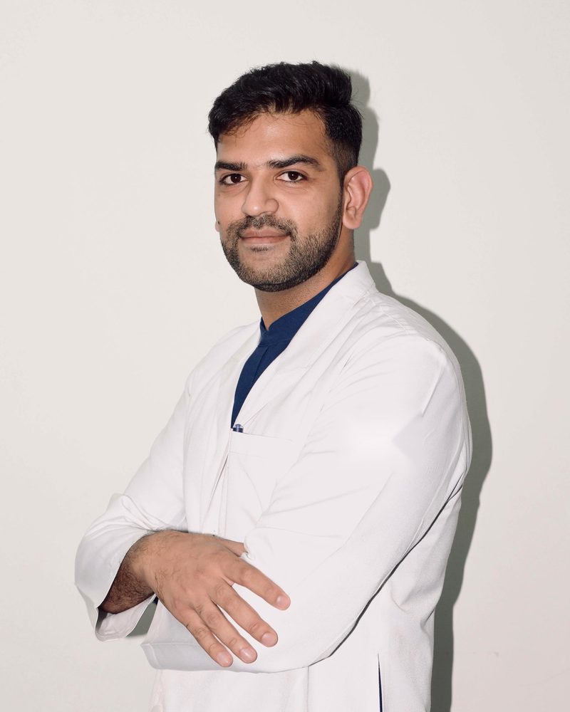 Dr. Kshitij Lochab in a white doctor's coat